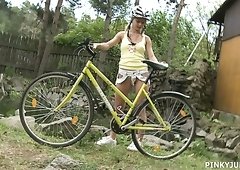 Sporty bicycle girl Pinky June doesn't mind stripping near the pond