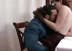 Glamorous man fucks a stunning shemale redhead on the table