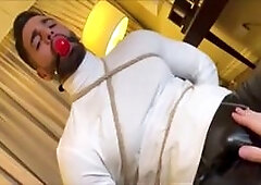 Bound guy wears Spidey costume tight