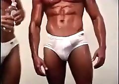 Swarthy Beefy Guys Oiling Each Other