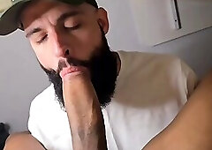 Sucking a massive uncut cock