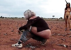 Art film with a pair angels chasing every other throughout a desert. At 1:25 one squats and takes a void urine.