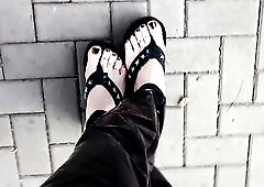 crossdresser in latex leggings and very hot flip-flops walks on the street and tempts with his marvelous feet