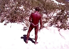 Tanned guy on beach in tiny string thong (temporarily!)