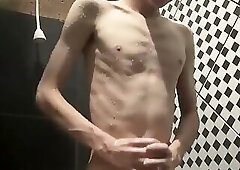 Skinny twink playing with his big dick and toy