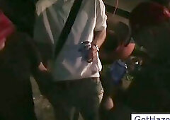 Blindfolded guys hazing outdoors