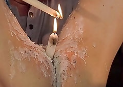 Alex Faux gets a candle in hos whole in a bondage session