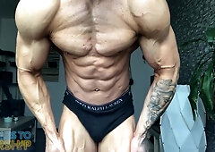 College Wrestler Flexes Muscles