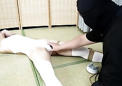 Tie the gal to a bamboo stick and tape her feet to make her feel itchy