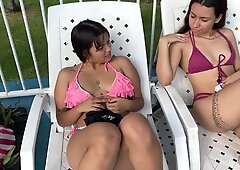 Two women explore passion at the poolside in a steamy lesbian encounter