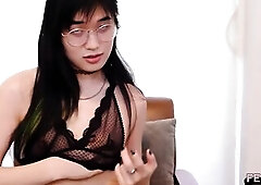See this skinny Oriental transsexual with glasses and tiny bazookas wank her knob during the time that widening wide on a wooden chair...