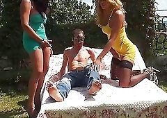 Kinky tranny chicks dominate the shaved head man in the hot threesome sex in the park