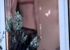 Babe can't even imagine that someone films her through the window