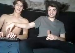 Two beautiful young guys masturbate together on the webcam