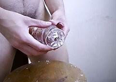 Hunky guy drills his Fleshlight toy and shoots his load