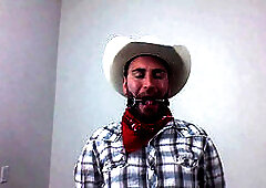 Scruffy guy in wild west setting selfgags with bit gag for gay bondage fun