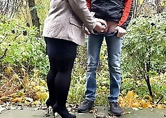 Sexy mother i'd like to fuck in hose and petticoat holding dude's ramrod outdoors whilst pissing