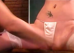 Fetish classroom scene with two lesbos, an apple and a ruler