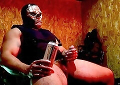 Buff guy in uniform giving himself a handjob with his massive cock