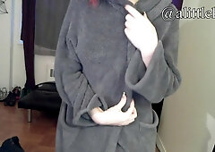 Redheaded goth Faith Rae teases in glasses before a seductive striptease