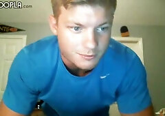 Buff blonde guy grabs his cock to stroke it wildly