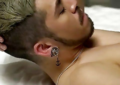 Two gay handsome studs make love in bedroom