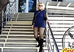 BLOND in tights AND BOOTS WALKS ON THE ROAD