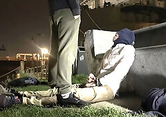 2 masculine folks, they don't know each other, urinating in a public place to greet each other.