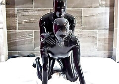 We are the one and the other wearing full latex catsuits. Gloomy, as my rubberdoll, plays with my latex schlong. Then I put her in doggystyle so I can