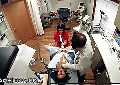 Doctor and nurse give a patient in a Superman shirt intense wand treatment during a medical exam