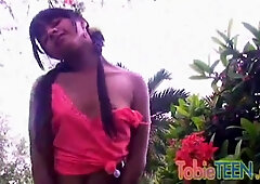 Tobie Teen Fingering her tight beaver at garden