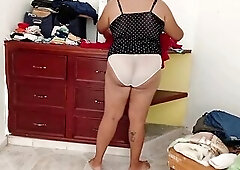 Overweight Mommy Tidying Up Room And Folding Laundry three