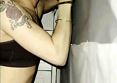 Transgirl sucking cock at the gloryhole at home