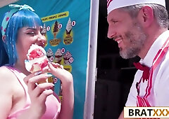Blue-haired young woman takes on the ice cream vendor in his truck