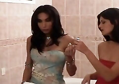 Shemale seduces a girl in the bathroom and pounds her
