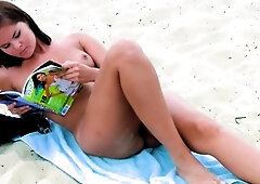 Playful young nudist with nice body is having fun the beach