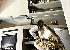 Curvy Norwegian brunette milf in a short skirt teases bare pussy and thick thighs in the kitchen with no panties during an upskirt striptease