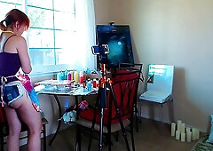 Red haired babe is wearing very short pants, so her butt cheeks are quite visible