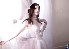 What a breathtaking set of Ana Acker clothed all in white and looking a ballerina or a bride.