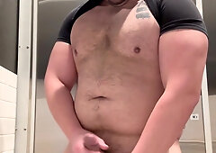 Muscled fellow in public toilet takes off down slobbers and milks on meaty boner before spunking