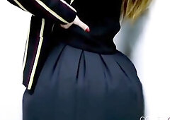 College angel Sophia Smith stands astride a fan that's blowing up her college petticoat. During the time that this babe's clothed in a full 