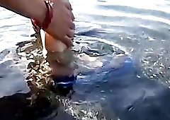 Gay guys relax in the water and enjoy toe licking