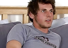 Handsome jock strips his clothes and masturbates after an interview