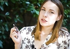 Smokin' meaty 120mm cigarette in the park on a sunny day