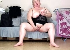 Stepmom Zona901 fingers her big tits and wet pussy while groaning