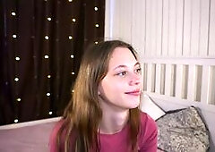Smiling Girl in Bedroom Tease