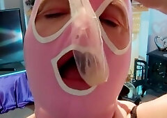 Uk tv floozy in latex hood playing and drinking used condoms. Fetish impure cumslut