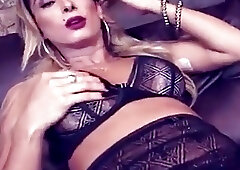 Classy blonde tranny in lingerie strokes her cock all alone