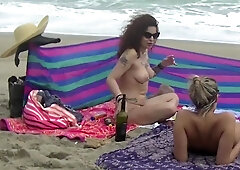 Exhibitionist milfs enjoy their day on the beach