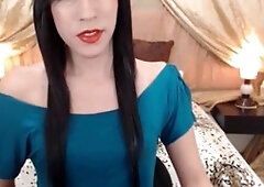 Naughty she-male teases and services her smooth shaft